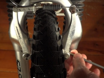 mountain bike or hybrid bike rubbing brakes